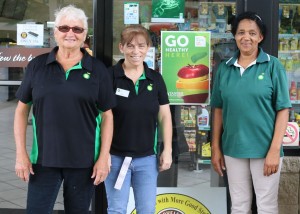 Employees Nadine Driver, Gina Abbott and Mary Tate stand in front of the Southside BP on Highway 27 in Carrollton.