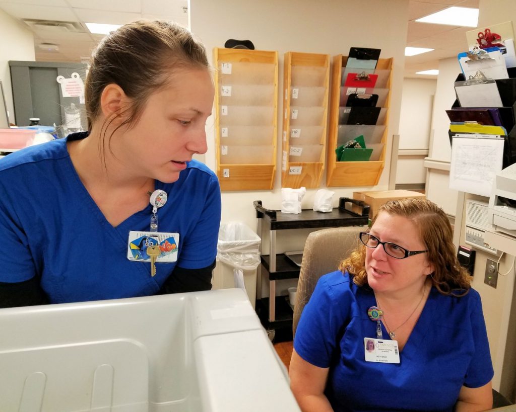 Jenna Smith, left, and Beth Gray, serve as unit secretaries in the emergency department at Higgins General Hospital in Bremen. The Atlanta Business Chronicle named Tanner Health System among the top 10 “Best Places to Work.”